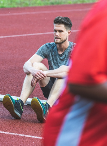 Runner sitting on the ground